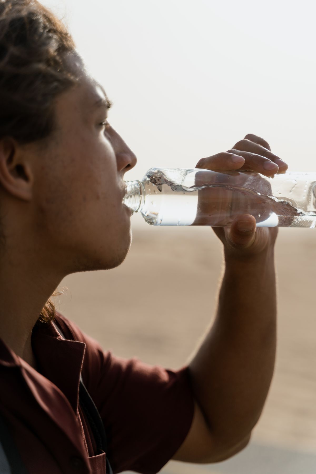 A man drinking clean water from a bottle in a North Florida home