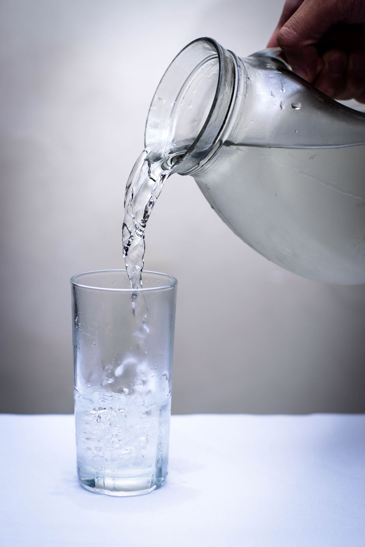 Pitcher of clean, clear treated water from a whole-home softener and filtration system